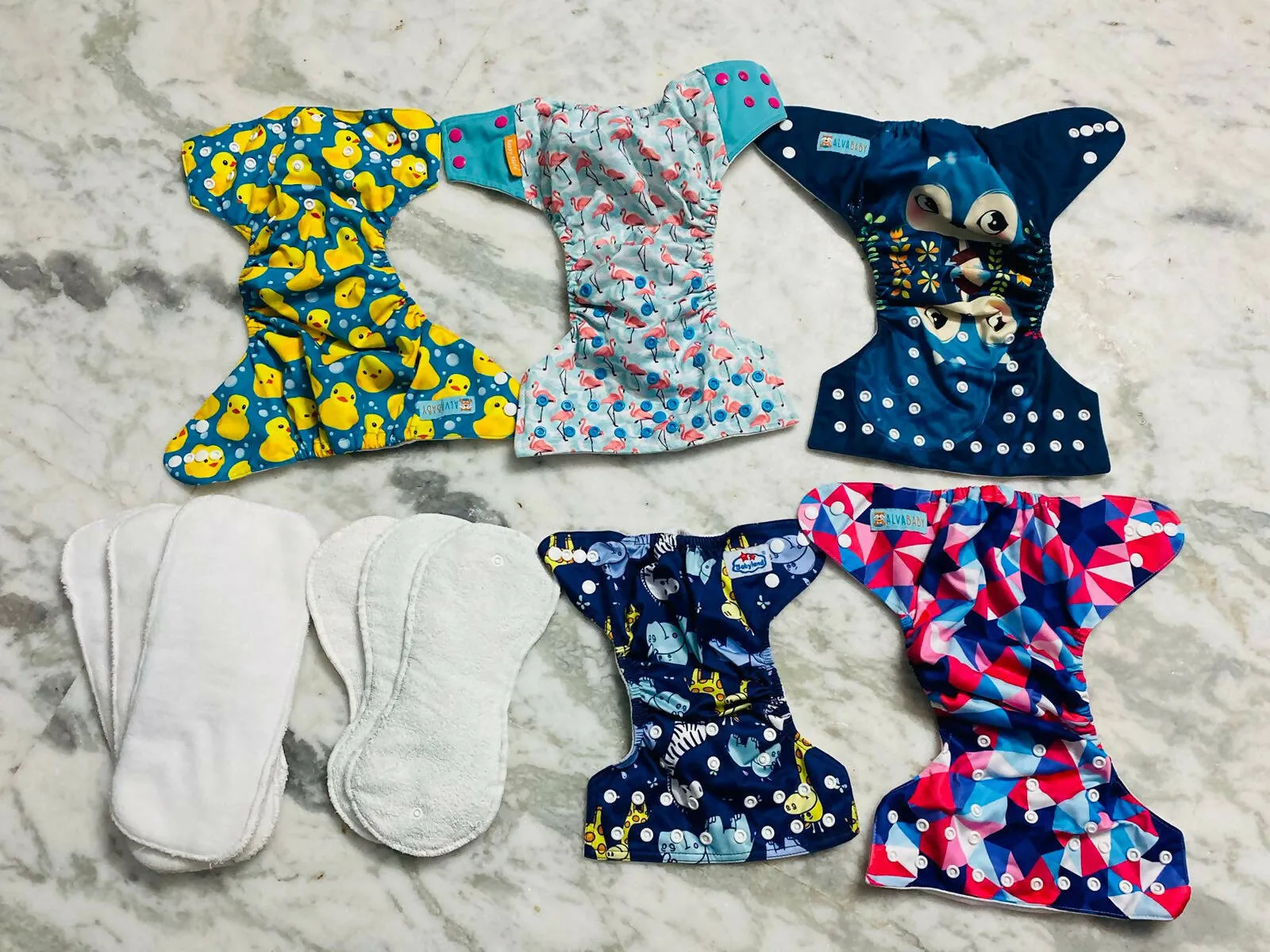 5 Cloth Diapers and 6 Pads for Baby